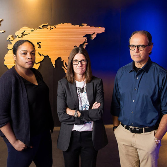 Three people in the Microsoft Digital Crimes Unit building.