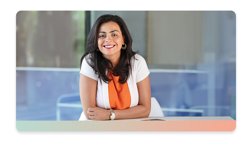 A woman smiling in an office setting