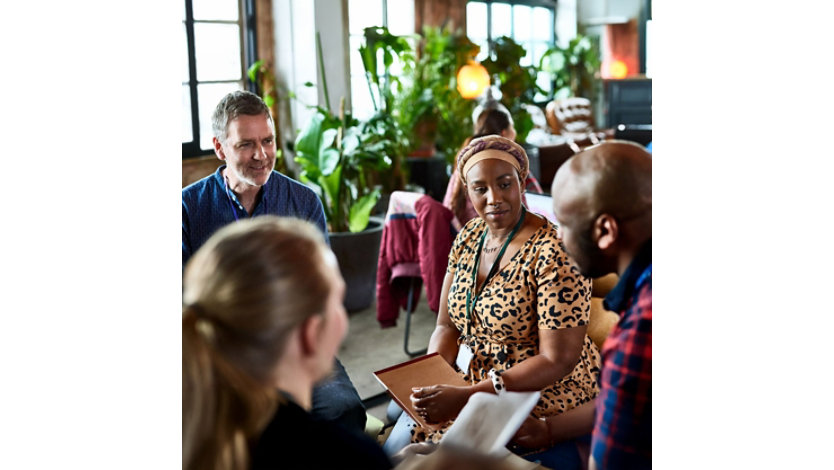 A group of people gathered in a discussion.