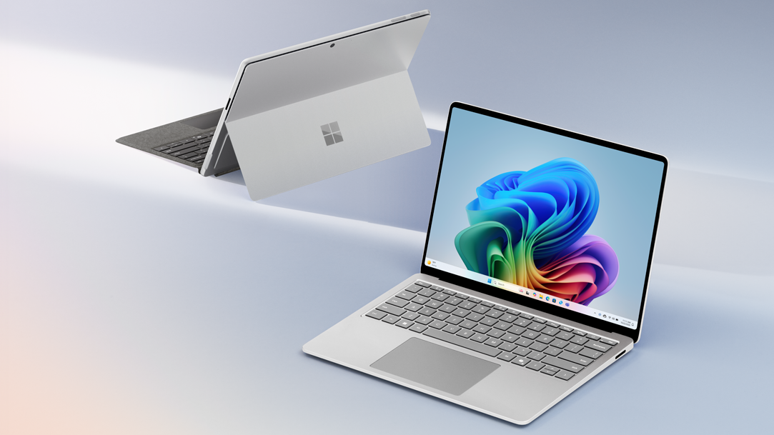 An image of Microsoft Surface Pro 11ᵗʰ Edition with Pro keyboard and Surface Laptop 7ᵗʰ Edition with Copilot+ PC Bloom pictured on screen