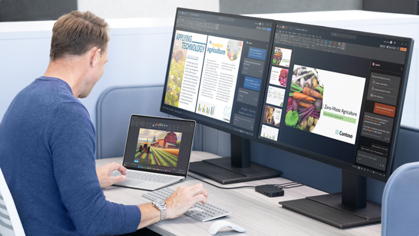 Man sitting using his Surface Laptop at his desk