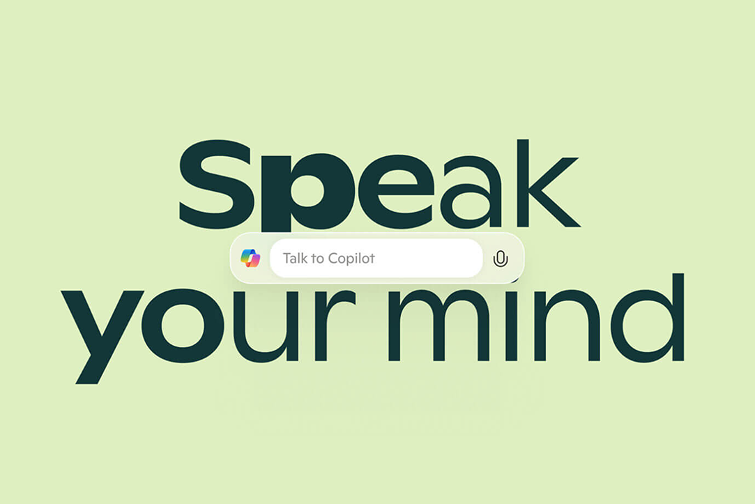The Copilot search bar with the words speak your mind written in large font above and below it on a light green background