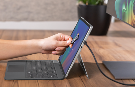 Person using NFC token for authentication on a Surface Pro 12-inch