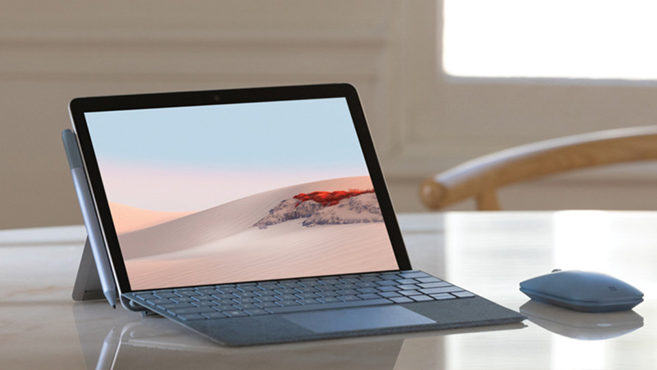 Surface Mobile Mouse, Surface device, and Surface Pen on a table.