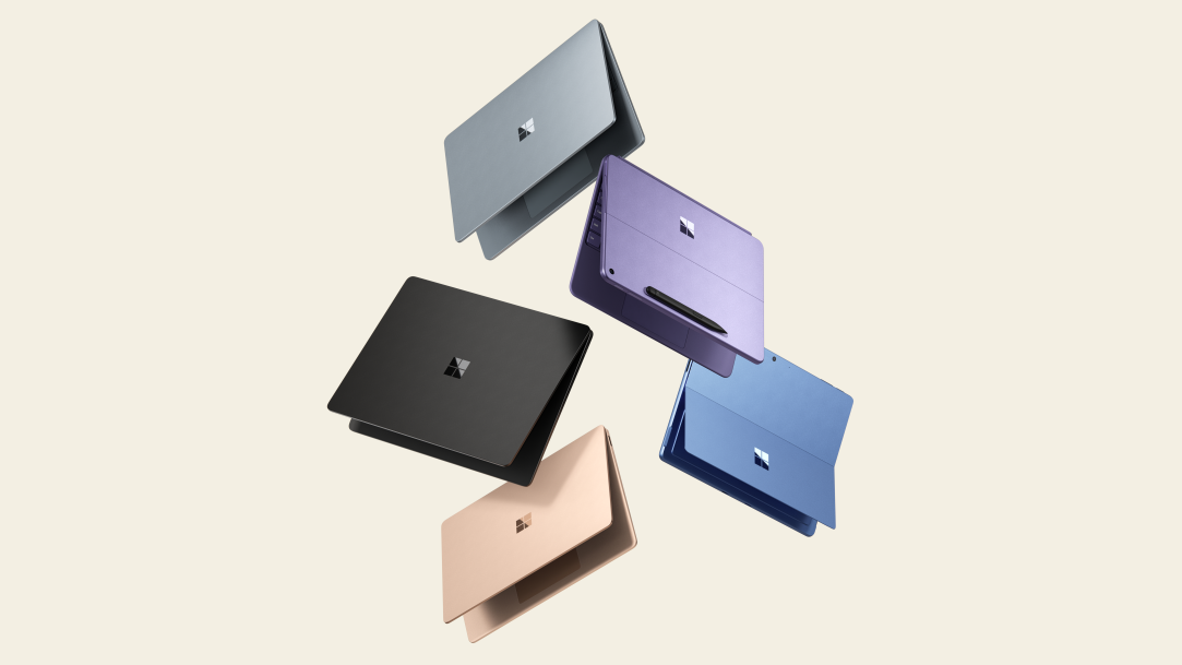An image of three Surface Pro and two Surface Laptops in different colors