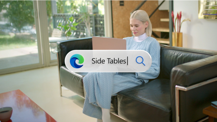 Man holding Windows laptop with OneDrive open